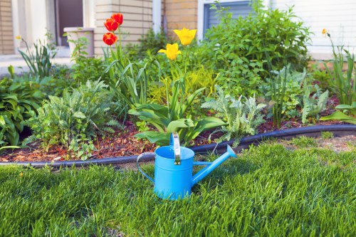 Gardener working on a small front garden in Seven Sisters