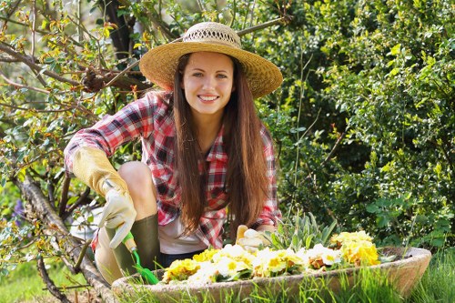 Operatives handling green waste responsibly in a terraced street